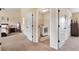 Hallway view with bedrooms, laundry room, and neutral decor at 4455 Orchard Lake Dr, Cumming, GA 30028