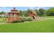 Neighborhood playground featuring a gazebo and a play structure with a slide and swings at 4455 Orchard Lake Dr, Cumming, GA 30028
