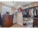 Walk-in closet with custom shelving, hanging racks, and ample storage space at 4455 Orchard Lake Dr, Cumming, GA 30028