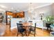Open dining area next to kitchen features hardwood floors and stylish furniture at 827 Perennial Dr, Atlanta, GA 30328