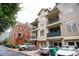 Multi-story townhome featuring private balconies, attached garages, and a mix of brick and siding at 827 Perennial Dr, Atlanta, GA 30328