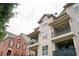 Exterior angle of townhomes with brick and siding, private balconies and dormer windows at 827 Perennial Dr, Atlanta, GA 30328