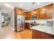 Spacious kitchen features stainless steel appliances, granite countertops, and hardwood floors at 827 Perennial Dr, Atlanta, GA 30328