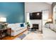 Open living room with fireplace, large windows, vaulted ceilings, and ample seating at 827 Perennial Dr, Atlanta, GA 30328