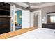 Spacious main bedroom showing doors to the main bath and sitting room at 827 Perennial Dr, Atlanta, GA 30328
