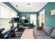 Home office featuring teal walls, natural light, a ceiling light, and a work space at 827 Perennial Dr, Atlanta, GA 30328