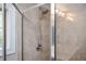 Close-up of glass shower with window and tile surround at 827 Perennial Dr, Atlanta, GA 30328