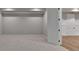 Basement with neutral carpeting, paneled walls, doorways to other rooms, and luxury vinyl flooring at 1169 Dorby Park Ne Dr, Brookhaven, GA 30319