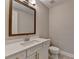 Bathroom featuring a white vanity, framed mirror, and toilet at 1169 Dorby Park Ne Dr, Brookhaven, GA 30319