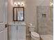 Bathroom features white cabinets, a large mirror, and a glass enclosed tiled shower at 1169 Dorby Park Ne Dr, Brookhaven, GA 30319