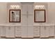 Bathroom features a double vanity, marble countertops, shaker cabinets, brushed gold hardware, and modern lighting at 1169 Dorby Park Ne Dr, Brookhaven, GA 30319
