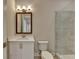 Bathroom features a modern vanity, a toilet, and a glass-enclosed shower with tile surround at 1169 Dorby Park Ne Dr, Brookhaven, GA 30319