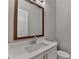 Bathroom featuring white sink, stone countertops, and dark framed mirror at 1169 Dorby Park Ne Dr, Brookhaven, GA 30319