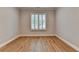Minimalist bedroom with beautiful hardwood floors and contemporary window with plantation shutters at 1169 Dorby Park Ne Dr, Brookhaven, GA 30319
