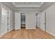 Bedroom features wood floors, neutral walls, white trim, and multiple doorways for easy closet access at 1169 Dorby Park Ne Dr, Brookhaven, GA 30319