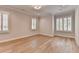 Comfortable bedroom with three plantation-shuttered windows, recessed lighting, and beautiful flooring at 1169 Dorby Park Ne Dr, Brookhaven, GA 30319