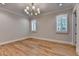 Bedroom with hardwood floors, crown molding, and windows with white shutters at 1169 Dorby Park Ne Dr, Brookhaven, GA 30319