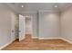 Bright bedroom with hardwood floors and multiple entryways to additional rooms at 1169 Dorby Park Ne Dr, Brookhaven, GA 30319