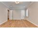 Bright bedroom features wood floors, neutral walls, white trim, recessed lighting, and a shuttered window at 1169 Dorby Park Ne Dr, Brookhaven, GA 30319