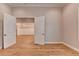 Bright bedroom features hardwood floors and white trim and is connected to other spaces at 1169 Dorby Park Ne Dr, Brookhaven, GA 30319