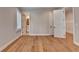 Bright bedroom with hardwood floors and multiple entryways to additional rooms at 1169 Dorby Park Ne Dr, Brookhaven, GA 30319