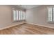Bright bedroom with hardwood floors, trimwork and large windows bringing in natural light at 1169 Dorby Park Ne Dr, Brookhaven, GA 30319