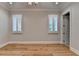 Spacious bedroom features hardwood floors, recessed lighting, and large windows with plantation shutters at 1169 Dorby Park Ne Dr, Brookhaven, GA 30319