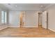 Bright bedroom features wood floors, neutral walls, white trim and multiple doorways for easy access to other areas at 1169 Dorby Park Ne Dr, Brookhaven, GA 30319