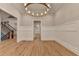 Dining room with wainscoting, chandelier, and gleaming wood floors at 1169 Dorby Park Ne Dr, Brookhaven, GA 30319