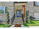 Close up of the front door with brick steps and a manicured yard at 1169 Dorby Park Ne Dr, Brookhaven, GA 30319