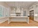 A kitchen featuring white cabinetry with gold hardware, a central island and stainless steel appliances at 1169 Dorby Park Ne Dr, Brookhaven, GA 30319