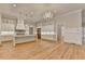 Spacious kitchen featuring a chandelier, recessed lights, and white cabinets with gold hardware at 1169 Dorby Park Ne Dr, Brookhaven, GA 30319