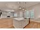 Kitchen with island, white cabinets, stone countertops, and stainless steel appliances at 1169 Dorby Park Ne Dr, Brookhaven, GA 30319