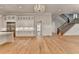 An open-concept kitchen featuring a staircase, stainless steel appliances, and recessed lights at 1169 Dorby Park Ne Dr, Brookhaven, GA 30319