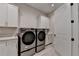 Bright laundry room featuring new appliances, ample cabinetry, and a convenient sink at 1169 Dorby Park Ne Dr, Brookhaven, GA 30319