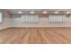 Bright living room with hardwood floors, panelled walls, and windows with white shutters at 1169 Dorby Park Ne Dr, Brookhaven, GA 30319