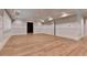 Bright living room with hardwood floors, paneled walls, doors and recessed lighting at 1169 Dorby Park Ne Dr, Brookhaven, GA 30319