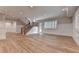 Bright living room with hardwood floors, paneled walls, stairs, doors and recessed lighting at 1169 Dorby Park Ne Dr, Brookhaven, GA 30319