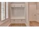 Mudroom area featuring a built-in bench and coat rack at 1169 Dorby Park Ne Dr, Brookhaven, GA 30319