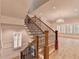 Elegant staircase with wood and ironwork connects to a large, bright living space at 1169 Dorby Park Ne Dr, Brookhaven, GA 30319