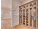 Custom wine storage display with glass door and wood shelving at 1169 Dorby Park Ne Dr, Brookhaven, GA 30319