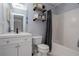 A well-lit bathroom with an organized shower and shelves at 203 Overlook Ct, Dallas, GA 30157
