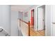 Upstairs hallway of home with wood railings and visible doorways at 203 Overlook Ct, Dallas, GA 30157