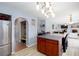 Eat-in kitchen features an island and stainless appliances with access to living spaces at 203 Overlook Ct, Dallas, GA 30157