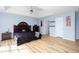 Spacious primary bedroom boasts hardwood floors, trey ceiling, and ample closet space at 203 Overlook Ct, Dallas, GA 30157
