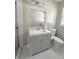 Bright bathroom featuring a large vanity and a toilet with a modern design at 3845 Pebble Beach Dr, Atlanta, GA 30349