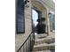 Inviting front door with decorative black shutters and beautiful brick facade at 3845 Pebble Beach Dr, Atlanta, GA 30349
