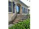Brick home featuring stairs to the front door, shutters, a black railing and manicured shrubs at 3845 Pebble Beach Dr, Atlanta, GA 30349