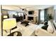 Open-concept living room featuring a brick fireplace and views of the kitchen and breakfast bar at 3845 Pebble Beach Dr, Atlanta, GA 30349