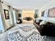 Bright living room with a large decorative rug, a leather sofa and lots of natural light at 3845 Pebble Beach Dr, Atlanta, GA 30349